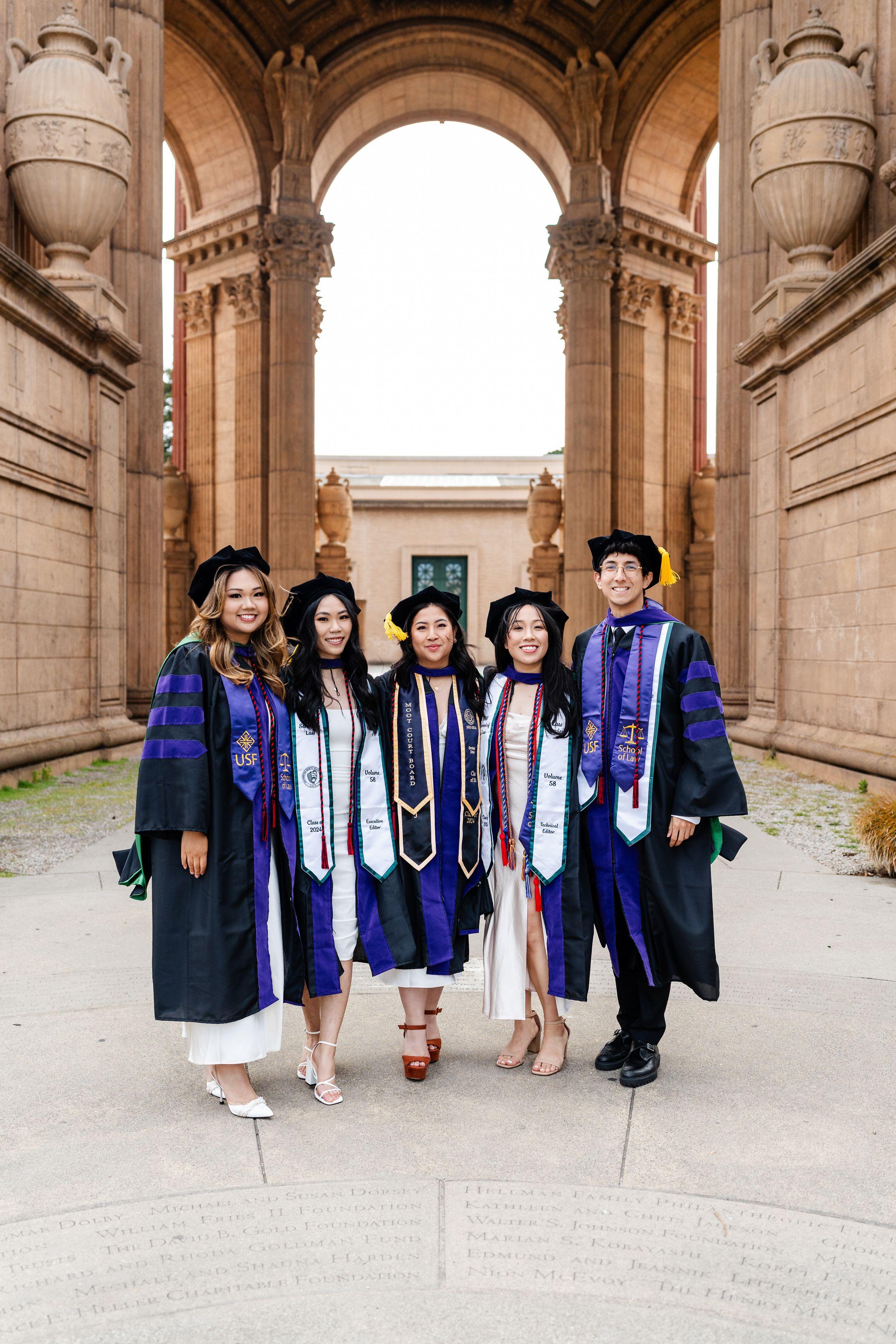 UC Law graduate poses for a golden hour portrait at the Palace of Fine Arts in San Francisco