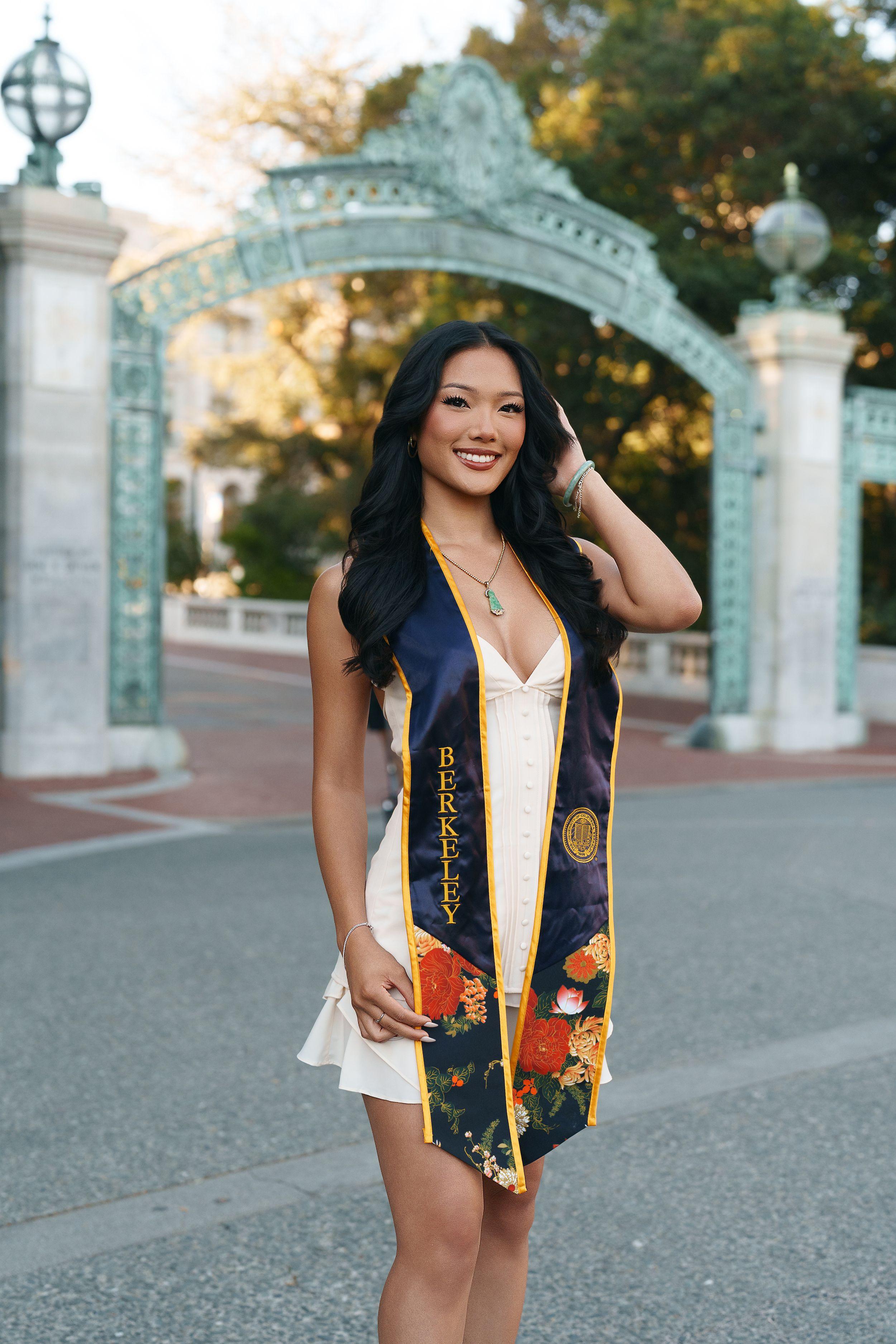 UC Berkeley graduate posing on campus during golden hour for a Bay Area graduation portrait session
