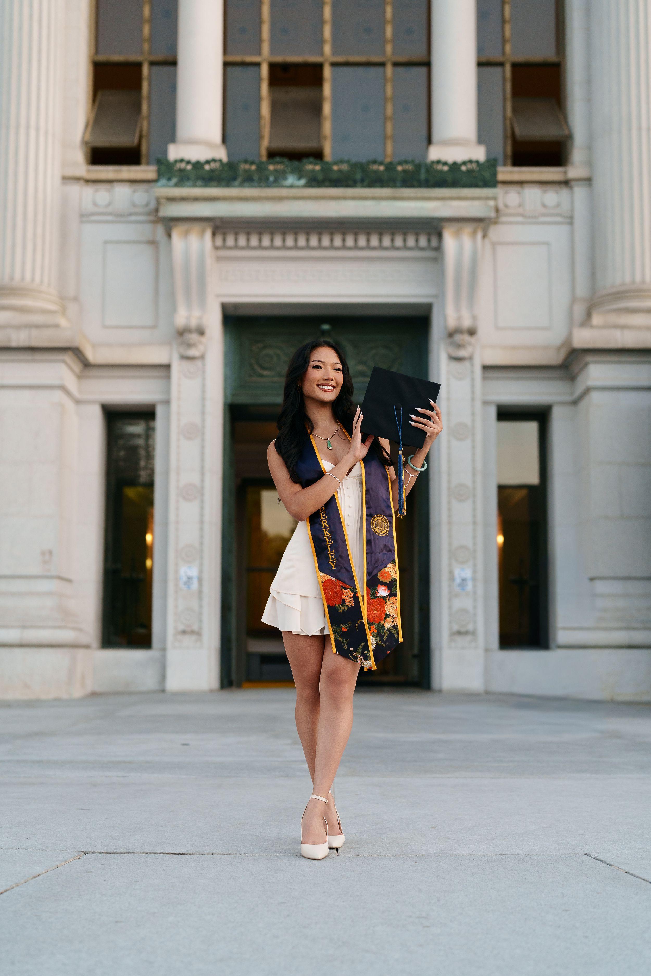 UC Berkeley graduate posing on campus during golden hour for a Bay Area graduation portrait session