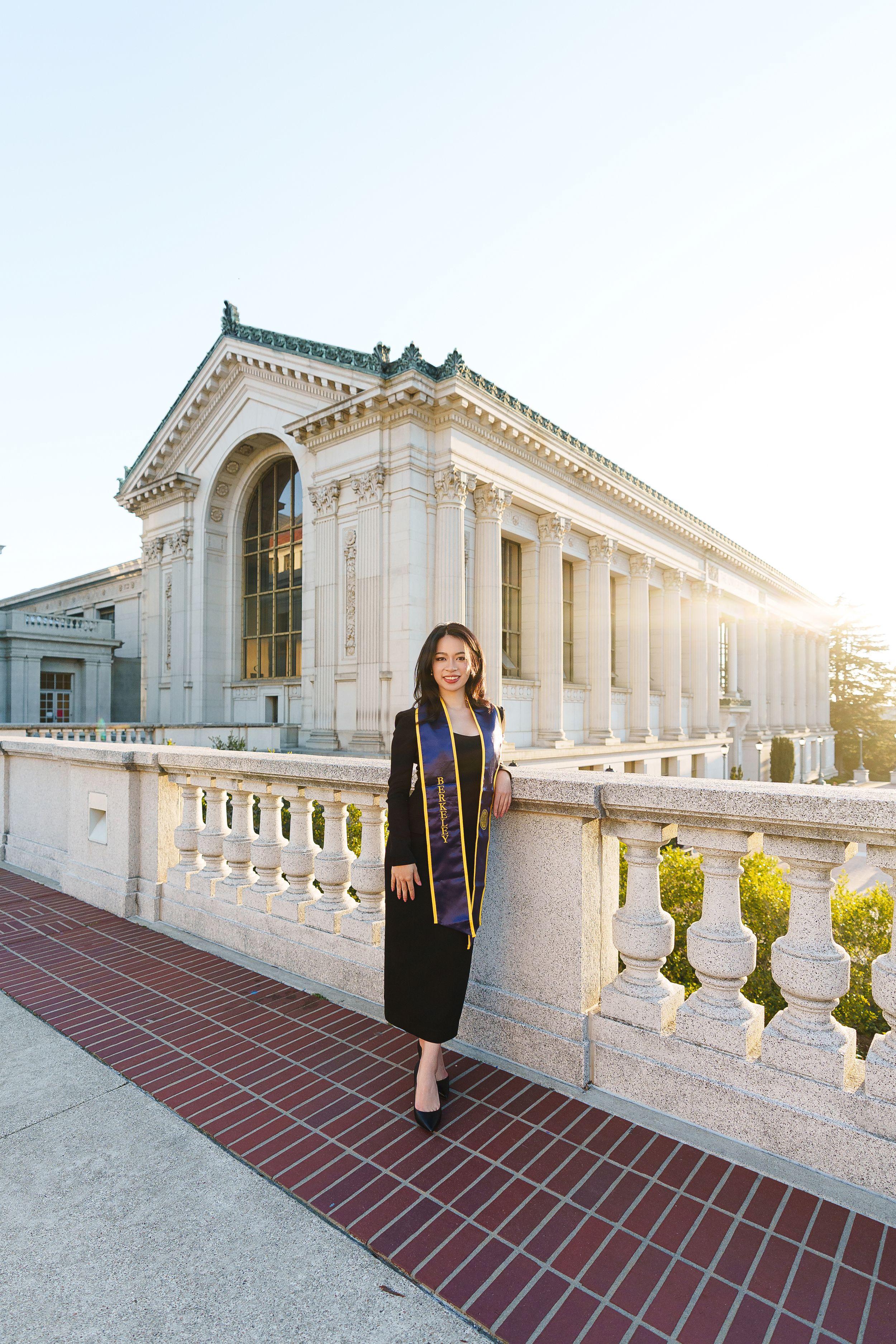 UC Berkeley graduate posing on campus during golden hour for a Bay Area graduation portrait session