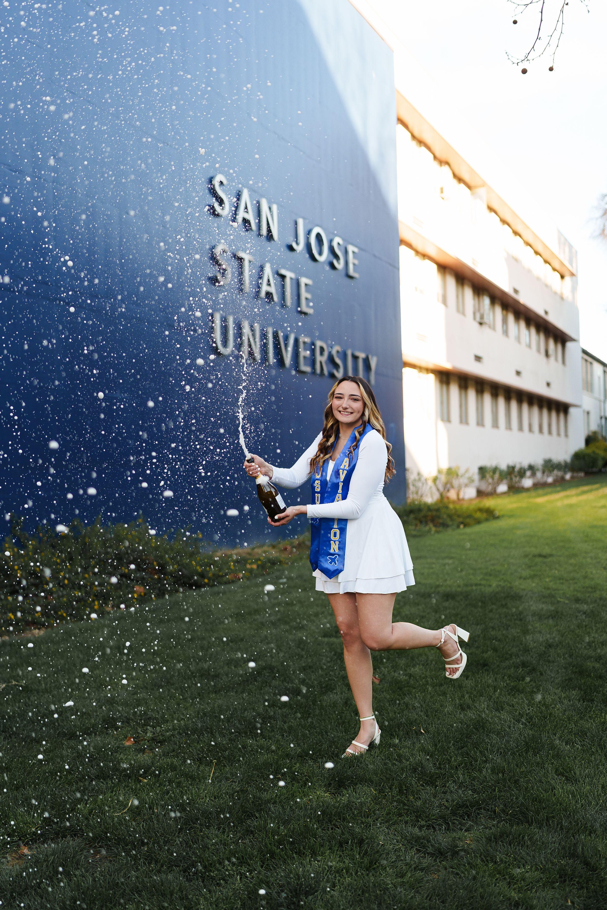 SJSU graduate posing on campus during golden hour for a Bay Area graduation portrait session
