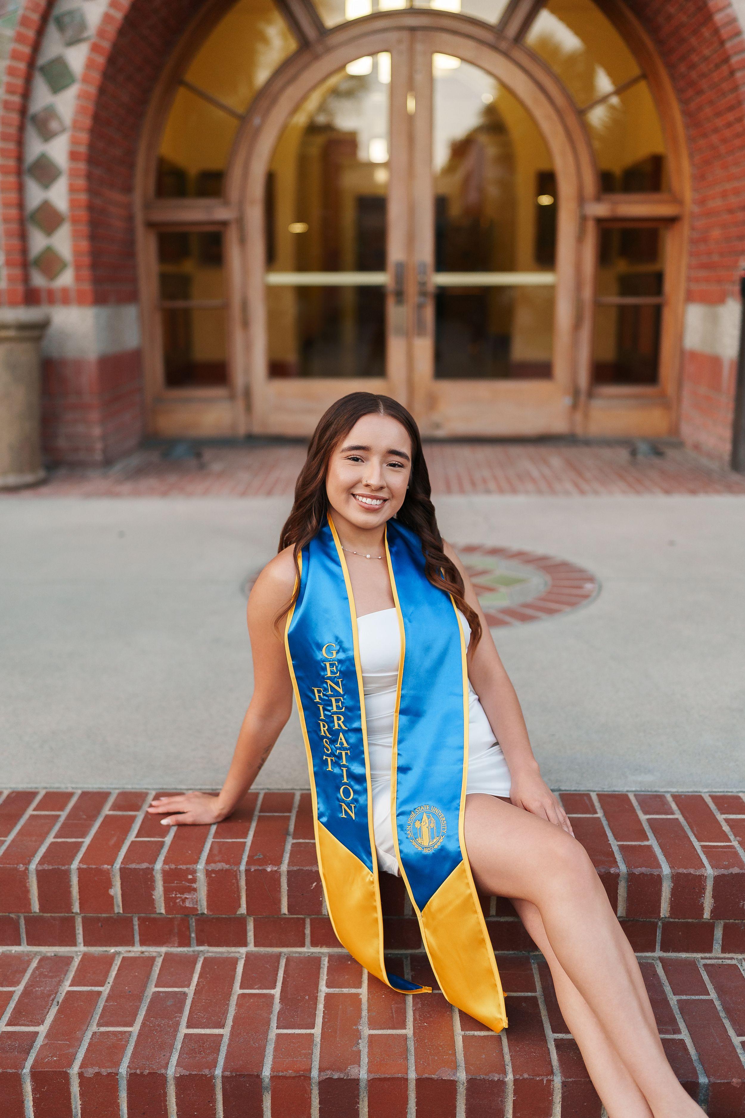 SJSU graduate poses on campus during golden hour for a Bay Area graduation portrait session